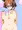 両乳を片手で掴む